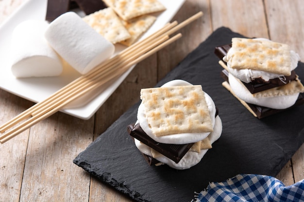 Homemade smores on wooden table typical American sweet