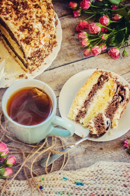 Homemade sour cream cake with tea. selective focus.