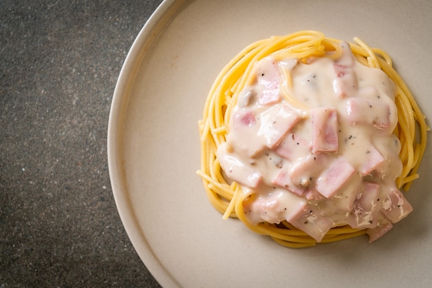 homemade spaghetti white cream sauce with ham - Italian food style