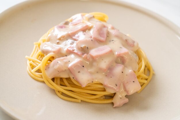 homemade spaghetti white cream sauce with ham - Italian food style