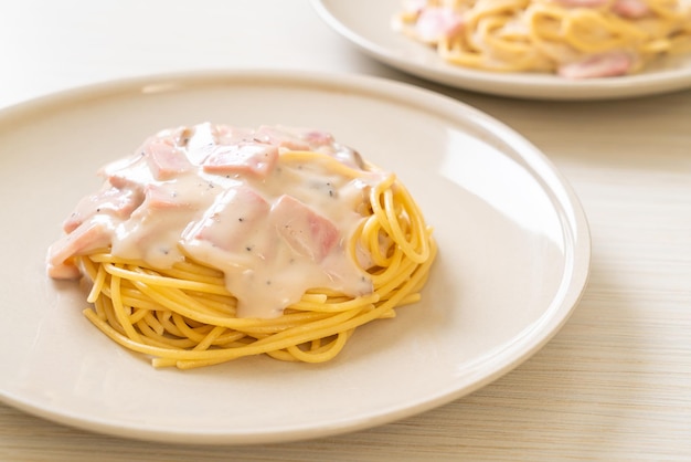 homemade spaghetti white cream sauce with ham - Italian food style