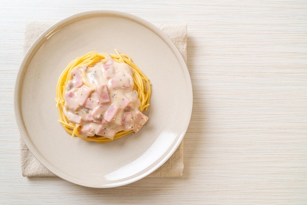 homemade spaghetti white cream sauce with ham - Italian food style