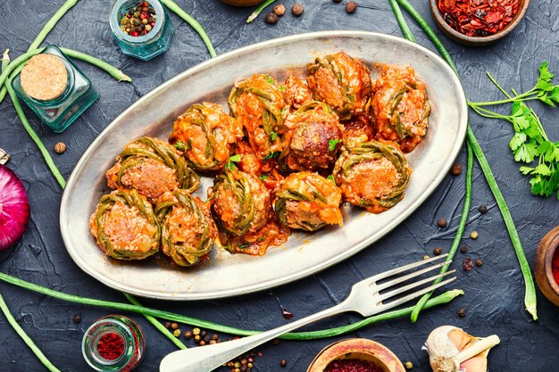 Homemade spicy cutlets or meatballs, stewed with asparagus beans.