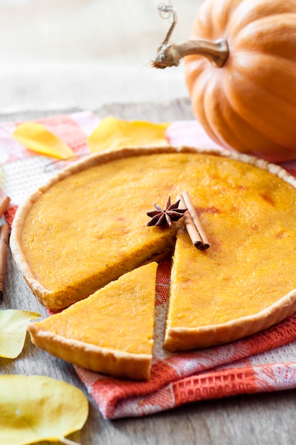 Homemade spicy pumpkin pie with cinnamon