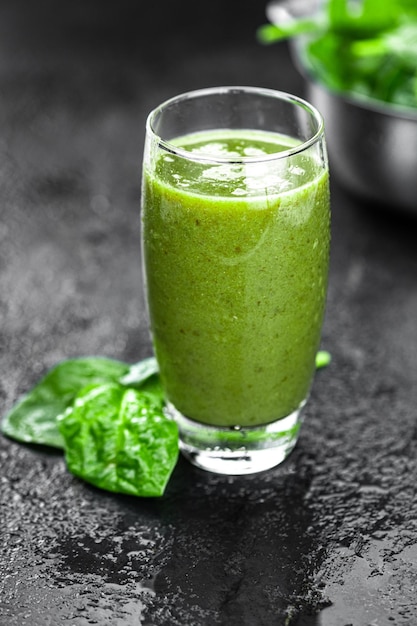 Homemade spinach smoothie close up selective focus