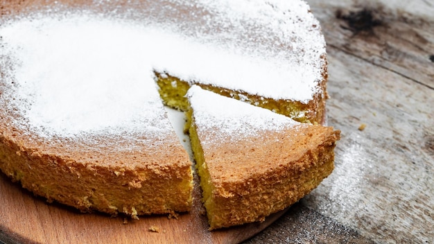 Homemade sponge cake on wooden table Bakery background Culinary cooking bakery concept place for text top view