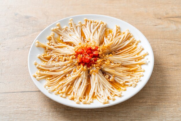 homemade steamed golden needle mushroom or enokitake with soy sauce, chilli and garlic