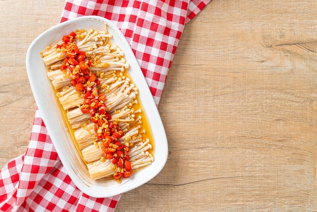 homemade steamed golden needle mushroom or enokitake with soy sauce, chilli and garlic