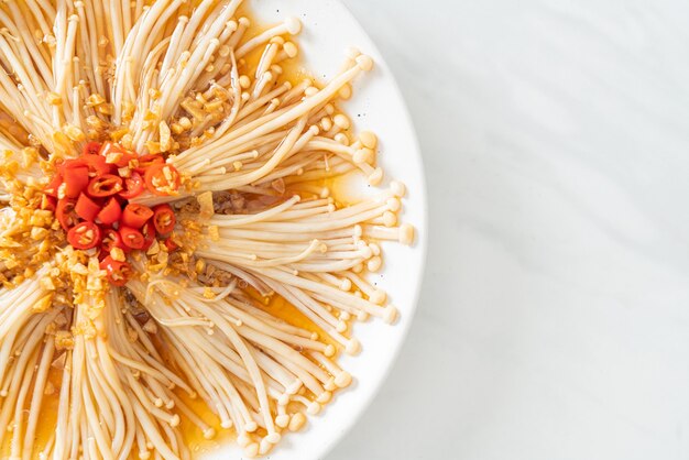 homemade steamed golden needle mushroom or enokitake with soy sauce, chilli and garlic