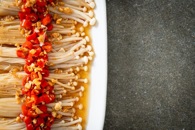 homemade steamed golden needle mushroom or enokitake with soy sauce, chilli and garlic