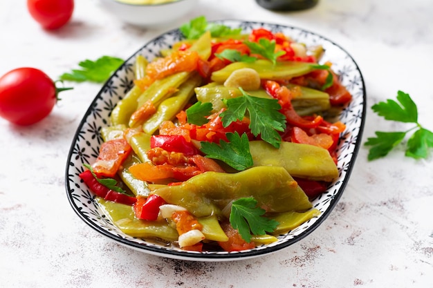 Homemade stewed green beans tomatoes garlic with olive oil Zeytinyagli fasulye traditional food Turkish cuisine