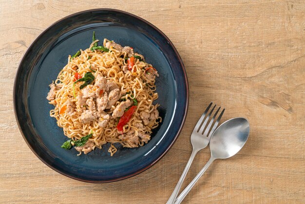 Homemade stir-fried instant noodles with thai basil and minced\
pork - thai food style