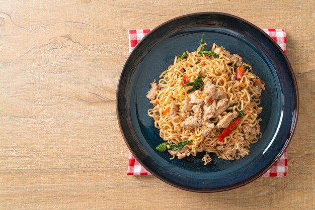 Homemade stir-fried instant noodles with thai basil and minced\
pork - thai food style