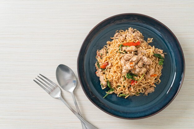 Homemade stir-fried instant noodles with thai basil and minced\
pork - thai food style