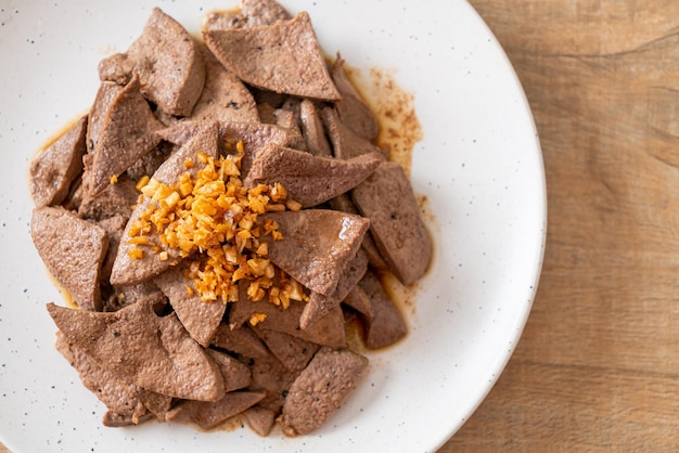 homemade stir-fried pork liver with garlic on plate