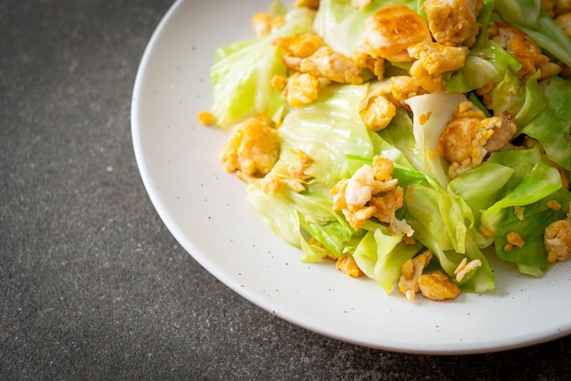 Homemade stirfried cabbage with egg on plate