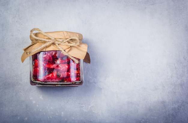 Homemade sundried tomatoes on a gray background