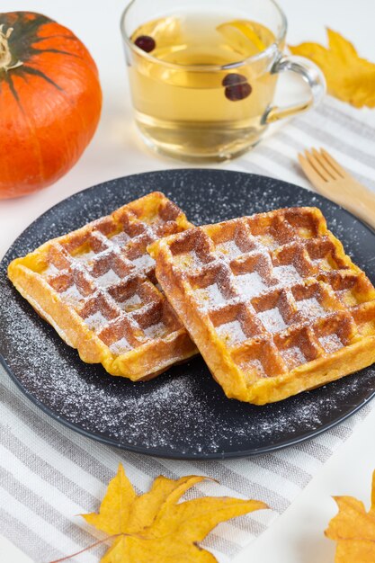 Homemade sweet Belgian waffles with powdered sugar