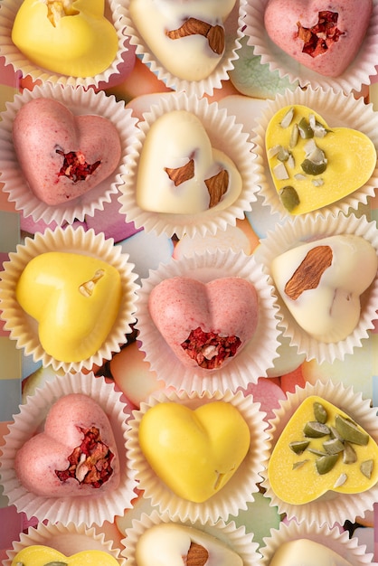 Homemade sweets heart-shaped strawberry powder with almonds, freeze-dried strawberries and pumpkin seeds