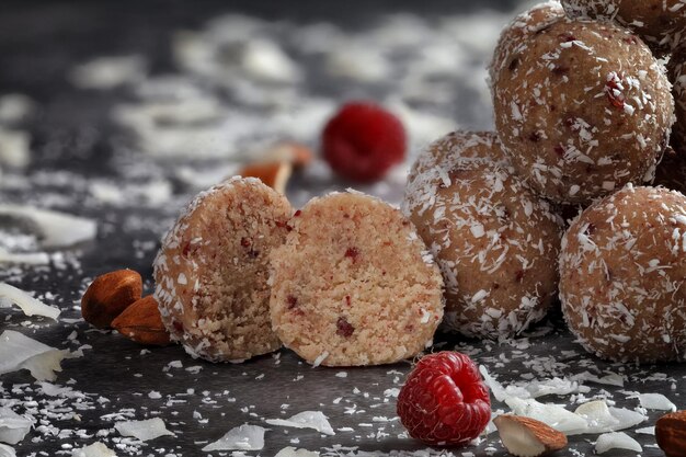 Homemade sweets with sublimated raspberry and coconut shavings