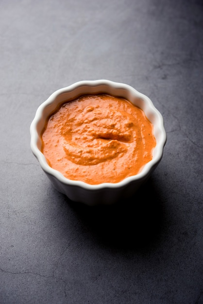 Homemade Tandoori Paste or Marinade mixture, in a bowl. used for grilled chicken or Paneer or vegetable.