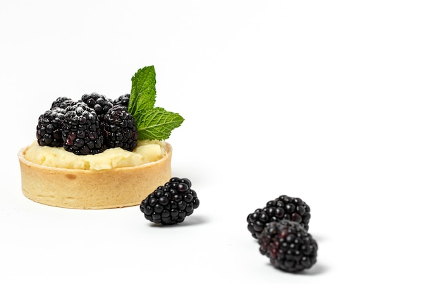 Homemade Tart with blackberry and delicate cream of vanilla and mint