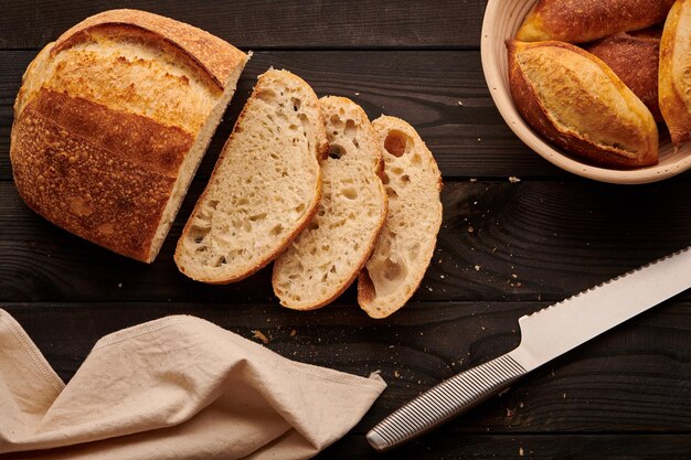 Homemade tartine bread on dark wooden table