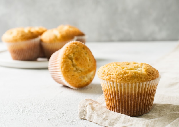 Homemade tasty miffins on white background, copy space, top view