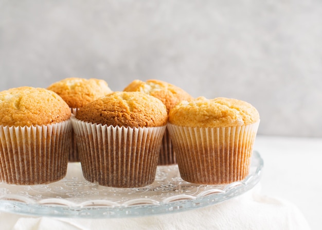 Homemade tasty miffins on white background, copy space, top view