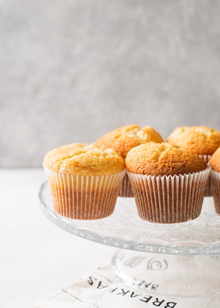 Homemade tasty miffins on white background, copy space, vertical