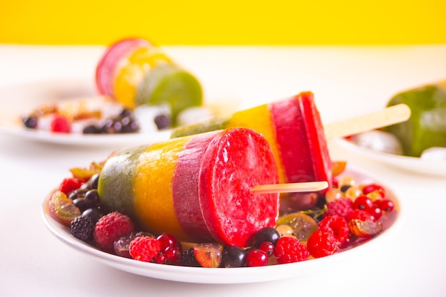 Homemade tasty vegan berries ice cream layered colorful popsicles Summer dessert