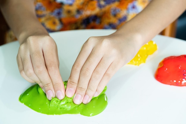 Homemade Toy Called Slime, Kids having fun and being creative by science experiment