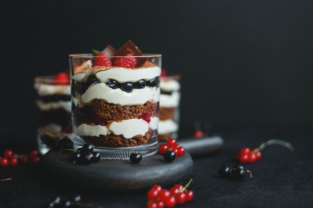 Homemade trifle dessert with raspberries, black currants, and cream cheese