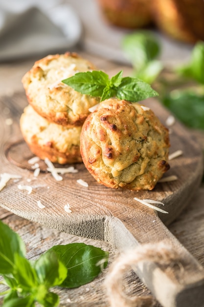 Homemade unsweetened savory appetizer cupcakes with ham, cheese, pesto.