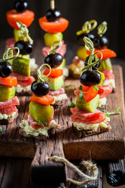 Homemade various cold snacks with vegetables and herbs for party