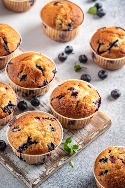 Homemade vegan blueberry muffins on white background