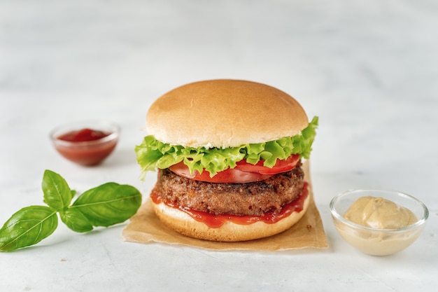 Homemade vegan burger on white rustic 