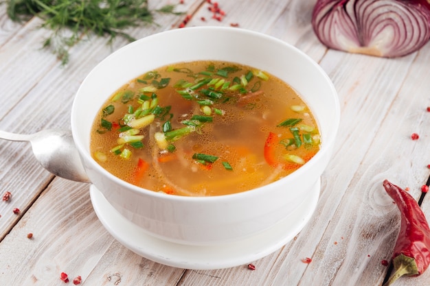 Homemade vegetable soup with green onions