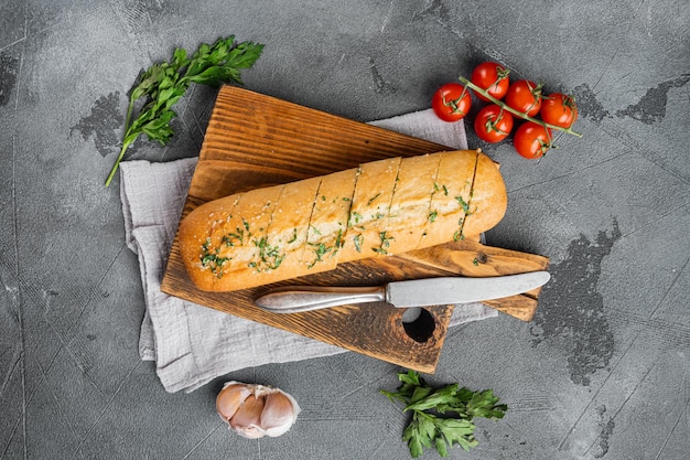 Homemade vegetarian sandwich cream cheese butter garlic bread on gray stone table background top view flat lay