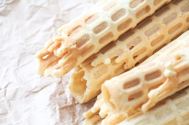 Homemade wafer rolls on crumpled baking paper