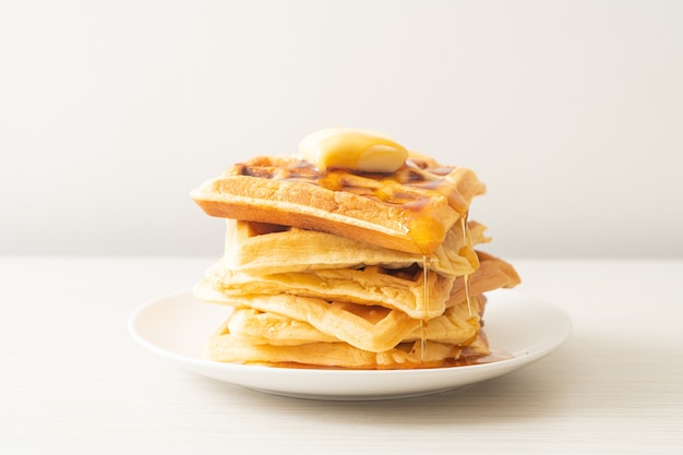 homemade waffle stack with butter and honey or maple syrup