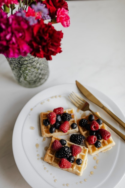 Homemade waffle with berries topping