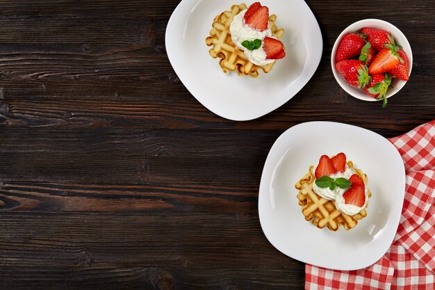 Homemade waffles decorated with strawberries