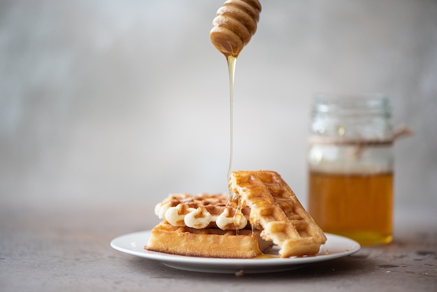 Homemade waffles with fresh honey