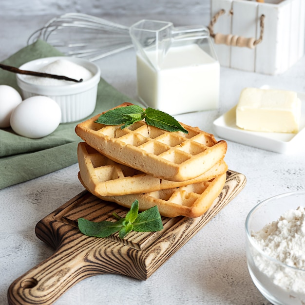 Homemade waffles with its ingredients