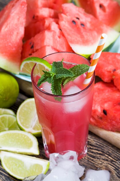 Homemade watermelon juice made in the summer or autumn season\
from ripe red and juicy watermelons, red juice without added sugar,\
a natural healthy and dietary product