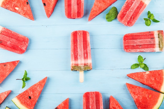 Homemade watermelon popsicles on a plate. Summer food concept.