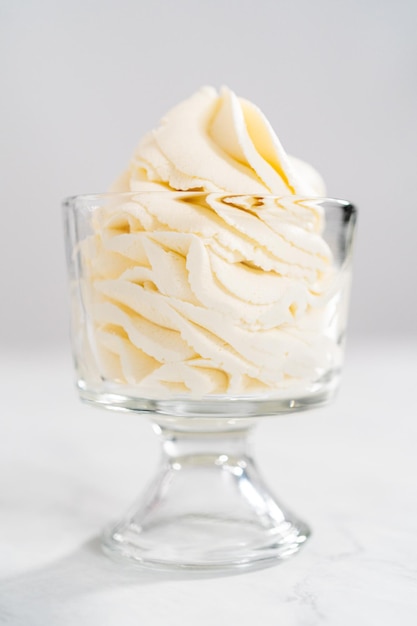 Homemade whipped cream in a class ice cream bowl.