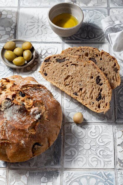 Homemade whole grain Mediterranean bread with olives and oregano