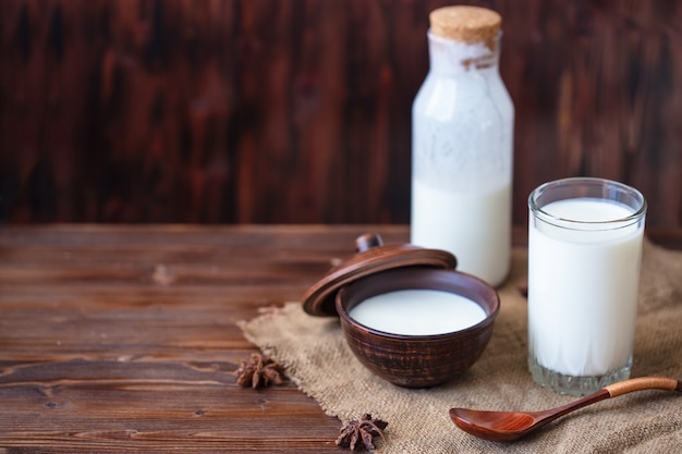 Homemade yogurt in a cup, a glass of kefir with probiotics Probiotic cold fermented dairy drink Trendy food and drink Copy space Rustic style.